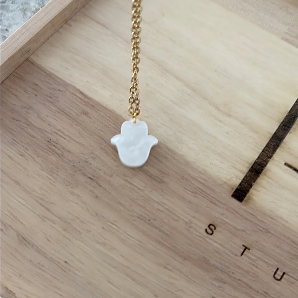 Gold Necklace with White Crescent Pendant
